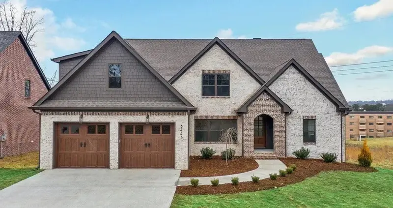 4-Bedroom Home With Optional Upstairs Bonus Area And Classic Brick Facade 1